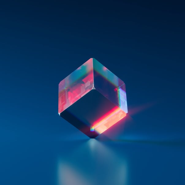 A multi-colored cube in a blue background